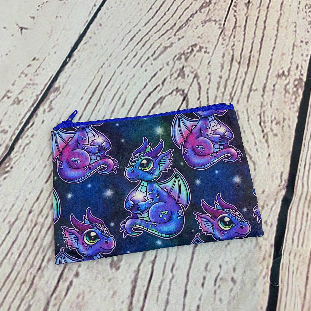 a small pouch with a dragon design on it