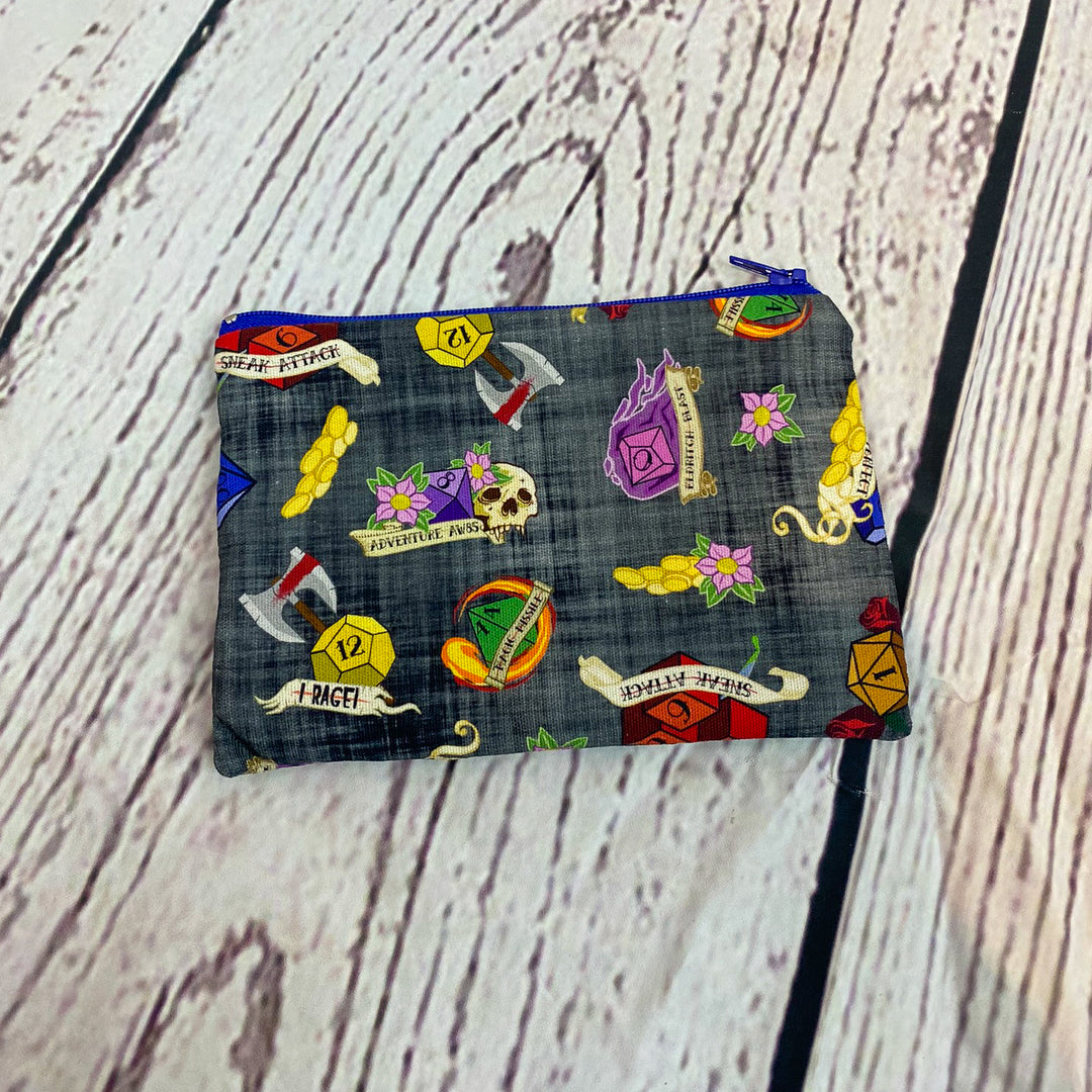 a small zippered pouch with a bunch of stickers on it